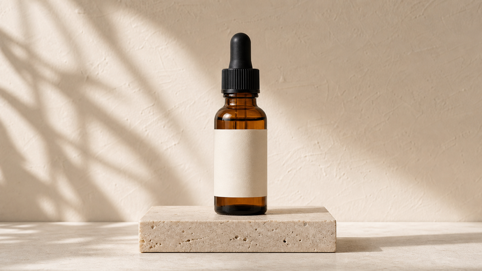 Amber serum bottle on a pale stone pedestal in soft window light